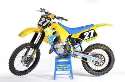 Yellow and blue RM125 Dirt Bike in DeCal Works Project Bike Gallery with #27 black and white number plates