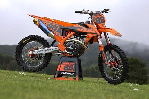 DeCal Works Think It. Create It. 221 Design Dirt Bike Graphics. Solid Orange and Grey Design with Black and Orange Gripper and Ribbed Seat Cover.