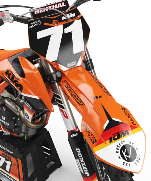 DeCal Works Think It. Create It. Series KTM dirt bike graphics in orange and black with red and yellow accent colors