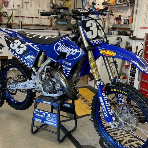 Yamaha YZ blue and white checkers dirt bike graphics on blue UFO plastic with Officially Licensed Works Connection Logo