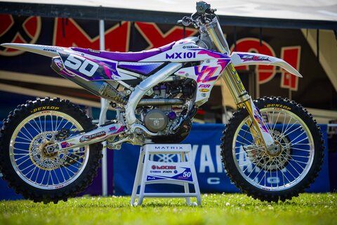 Purple and white throw back yamaha complete dirt bike graphics with #50 Austin Jones side view of YZF dirt bike